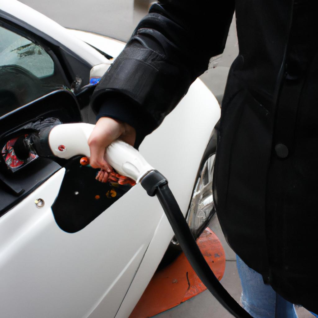 Person using electric car charger