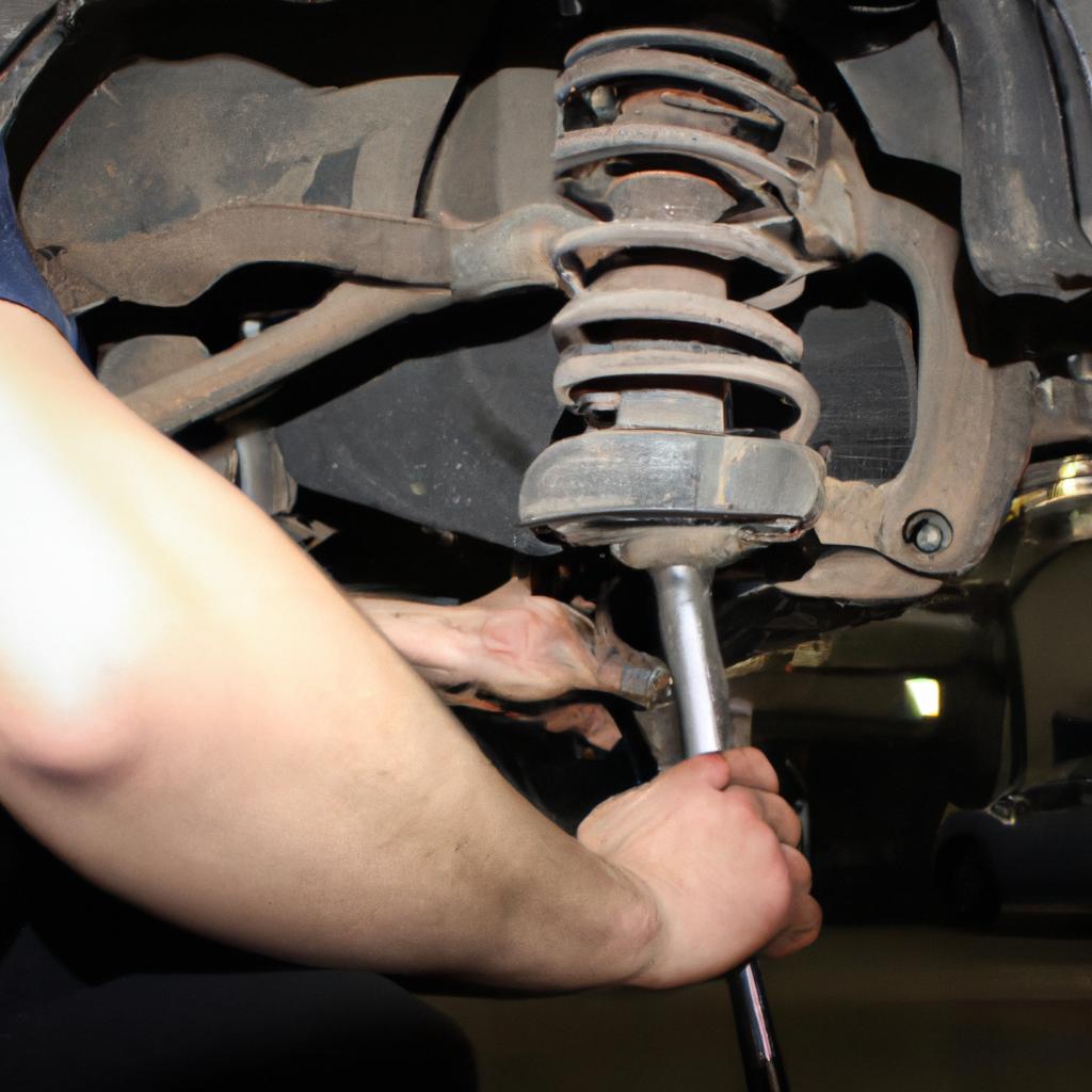 Person working on car suspension